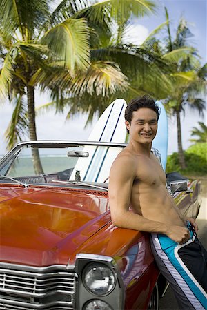 surfboard close up - Portrait of a young man leaning against a car and smiling Stock Photo - Premium Royalty-Free, Code: 640-01349196