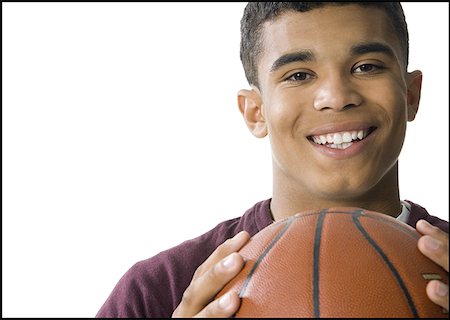 simsearch:640-01349238,k - Portrait of a young man holding a basketball Stock Photo - Premium Royalty-Free, Code: 640-01349231