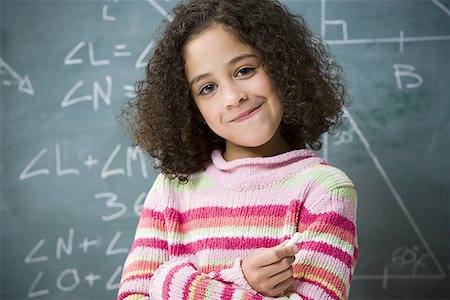 simsearch:640-01357979,k - Portrait of a girl standing in front of a blackboard Stock Photo - Premium Royalty-Free, Code: 640-01349267