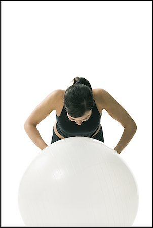 flier - Close-up of a woman exercising on a fitness ball Stock Photo - Premium Royalty-Free, Code: 640-01349651