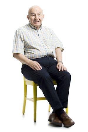 Portrait of a senior man sitting on a chair Stock Photo - Premium Royalty-Free, Code: 640-01349812