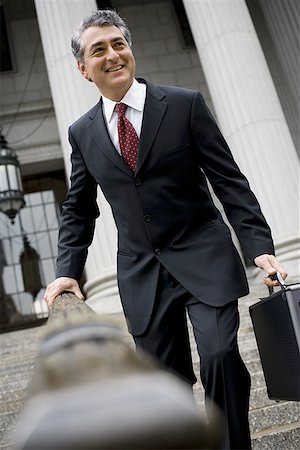 simsearch:640-02767805,k - Low angle view of a man walking down the steps of a courthouse Stock Photo - Premium Royalty-Free, Code: 640-01349868