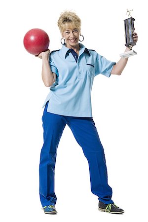 simsearch:693-06325208,k - Female bowler holding trophy Stock Photo - Premium Royalty-Free, Code: 640-01349946