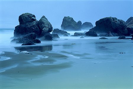 environmental impact - Waves breaking on rocks at a beach Stock Photo - Premium Royalty-Free, Code: 640-01349996