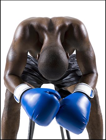 Boxer sitting on stool Stock Photo - Premium Royalty-Free, Code: 640-01354170