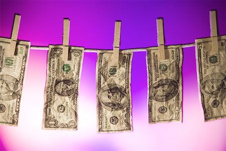 Close-up of money hanging on a clothes line Stock Photo - Premium Royalty-Free, Code: 640-01354254