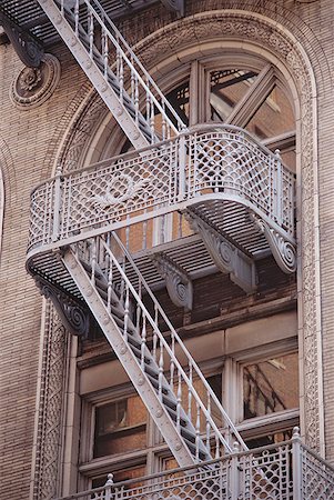 Low angle view of a fire escape outside a building Stock Photo - Premium Royalty-Free, Code: 640-01354269