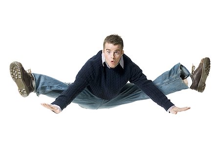 simsearch:640-01361005,k - Portrait of a young man jumping in mid air Stock Photo - Premium Royalty-Free, Code: 640-01354302
