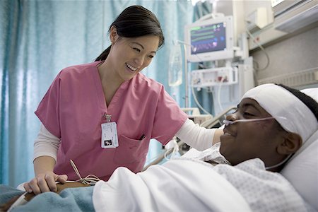 sick black woman - Female nurse talking to a patient Stock Photo - Premium Royalty-Free, Code: 640-01354369
