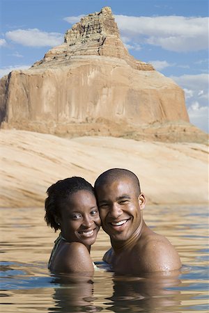 simsearch:640-01358229,k - Portrait of a young couple standing in a lake Stock Photo - Premium Royalty-Free, Code: 640-01354411