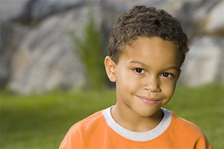 Portrait of a boy smiling Stock Photo - Premium Royalty-Free, Code: 640-01354670