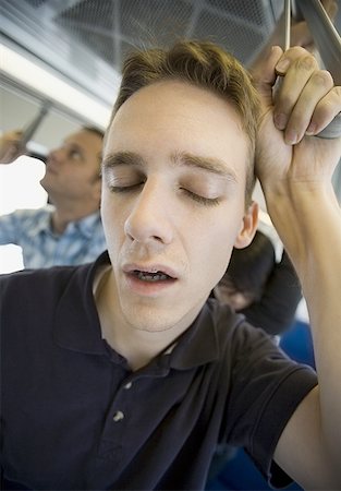 rush hour - Close-up of a young man sleeping on a commuter train Stock Photo - Premium Royalty-Free, Code: 640-01354696