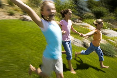 six people holding hands - Three girls holding hands and running Stock Photo - Premium Royalty-Free, Code: 640-01354719