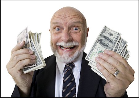 Portrait of a businessman holding American dollar bills Stock Photo - Premium Royalty-Free, Code: 640-01355000
