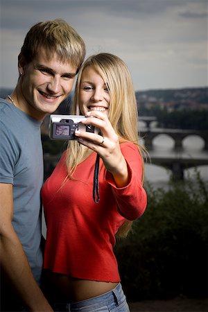simsearch:400-04847852,k - Close-up of a young man and a young woman photographing themselves Stock Photo - Premium Royalty-Free, Code: 640-01355295