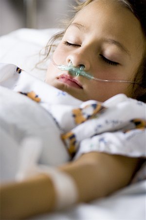 respirator - Young girl in hospital bed with respirator Stock Photo - Premium Royalty-Free, Code: 640-01355385