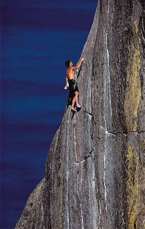 simsearch:6118-09039107,k - Low angle view of a man rock climbing Stock Photo - Premium Royalty-Free, Code: 640-01355433