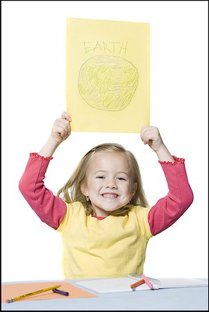 pencil crayon - Portrait of a girl holding a drawing of the Earth Foto de stock - Sin royalties Premium, Código: 640-01355586