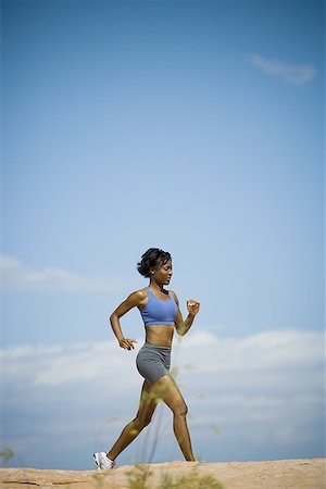 simsearch:640-01361005,k - Profile of a young woman jogging Stock Photo - Premium Royalty-Free, Code: 640-01355582