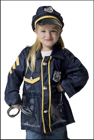 female police officer happy - Portrait d'une jeune fille habillée en agent de police Photographie de stock - Premium Libres de Droits, Code: 640-01355723