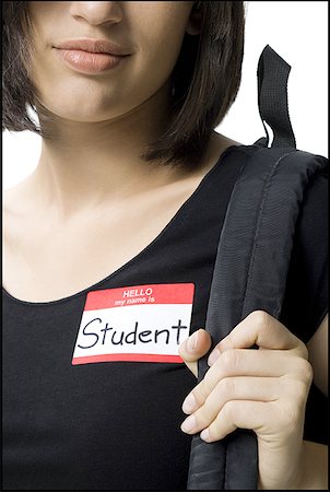 Close-up of a young woman carrying a bag on her shoulder Stock Photo - Premium Royalty-Free, Code: 640-01355887