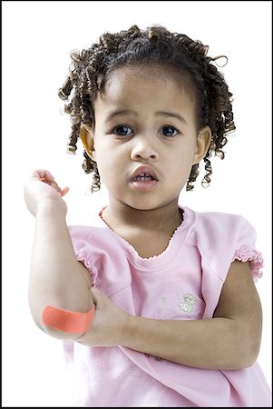 simsearch:640-01359777,k - Portrait of a girl showing an adhesive bandage on her elbow Stock Photo - Premium Royalty-Free, Code: 640-01356167