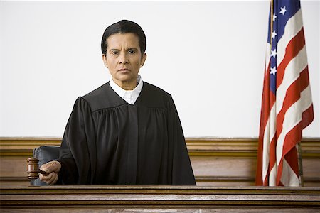 simsearch:640-01350504,k - Portrait of a female judge holding a gavel Foto de stock - Sin royalties Premium, Código: 640-01356212