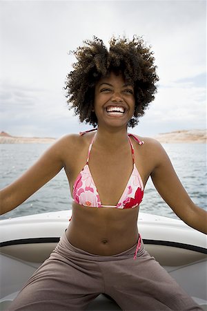 simsearch:640-01358229,k - Young woman sitting on a speed boat Stock Photo - Premium Royalty-Free, Code: 640-01356281