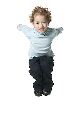 Portrait of a boy jumping Stock Photo - Premium Royalty-Free, Code: 640-01356377