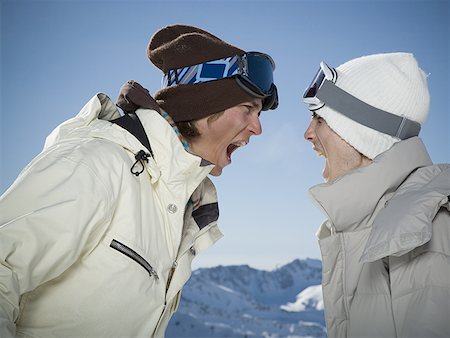 snow fight - Profile of two young men arguing Stock Photo - Premium Royalty-Free, Code: 640-01356503