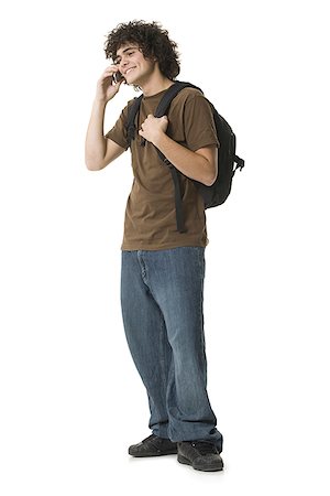 simsearch:640-03260747,k - Teenage boy using a phone and smiling Stock Photo - Premium Royalty-Free, Code: 640-01356616