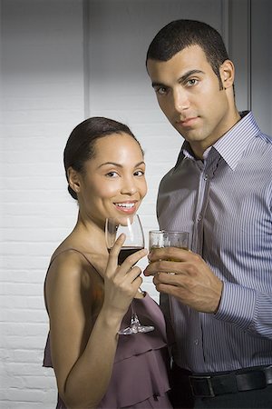 simsearch:640-01350537,k - Portrait of a young couple at a party Stock Photo - Premium Royalty-Free, Code: 640-01356697