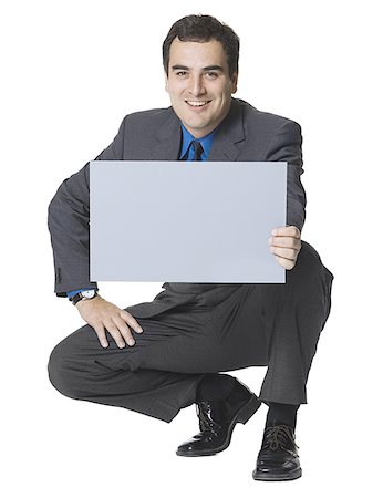 simsearch:640-01349238,k - Businessman holding a blank sign Stock Photo - Premium Royalty-Free, Code: 640-01356702