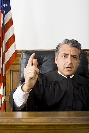 simsearch:640-01351636,k - Portrait of a male judge pointing Foto de stock - Sin royalties Premium, Código: 640-01356825