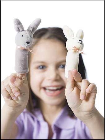 Girl with finger puppets Stock Photo - Premium Royalty-Free, Code: 640-01356968