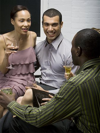 simsearch:640-01350537,k - Two couples at a party Stock Photo - Premium Royalty-Free, Code: 640-01357135