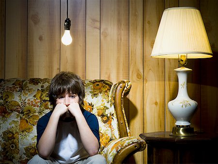 simsearch:640-01362739,k - Boy on sofa with light bulb and lamp Stock Photo - Premium Royalty-Free, Code: 640-01357200
