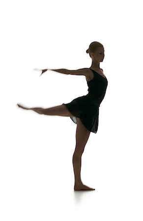 simsearch:640-01351921,k - Silhouette of a female ballerina standing on one leg Foto de stock - Sin royalties Premium, Código: 640-01357364
