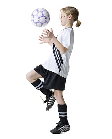 do - Profile of a girl practicing with a soccer ball Stock Photo - Premium Royalty-Free, Code: 640-01357360