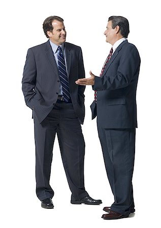 executive standing white background - Two businessmen talking and smiling Stock Photo - Premium Royalty-Free, Code: 640-01357459