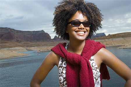 simsearch:640-01358229,k - Close-up of a young woman smiling Stock Photo - Premium Royalty-Free, Code: 640-01357584