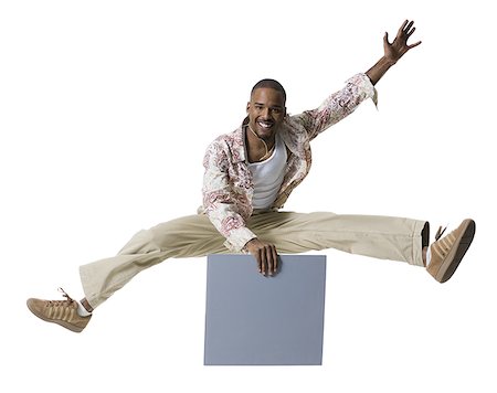 simsearch:640-03265333,k - African American man jumping and holding a blank sign Stock Photo - Premium Royalty-Free, Code: 640-01357597