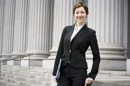 simsearch:640-02767805,k - Portrait of a female lawyer smiling Stock Photo - Premium Royalty-Free, Code: 640-01357639