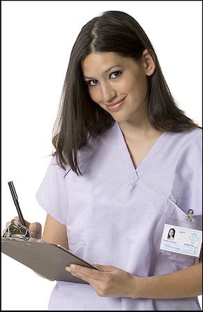 simsearch:640-01364042,k - Portrait of a female nurse holding a clipboard Stock Photo - Premium Royalty-Free, Code: 640-01357683