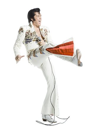 funny dance pose - An Elvis impersonator dancing Stock Photo - Premium Royalty-Free, Code: 640-01358294