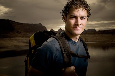 period - Portrait of a young man carrying a backpack Stock Photo - Premium Royalty-Free, Code: 640-01358407