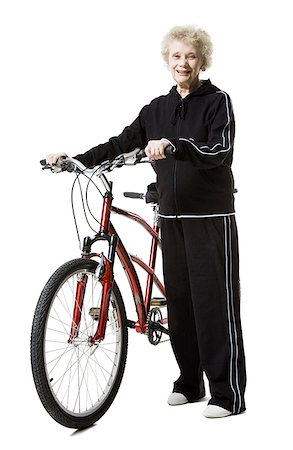 Older woman with a tandem bicycle Stock Photo - Premium Royalty-Free, Code: 640-01358520