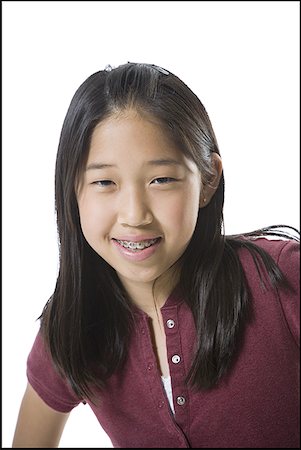 simsearch:640-01365707,k - Close-up of a teenage girl smiling Stock Photo - Premium Royalty-Free, Code: 640-01358593