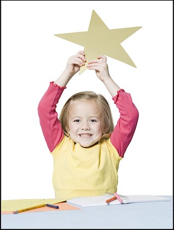 stars on white background - Portrait of a girl holding a star Stock Photo - Premium Royalty-Free, Code: 640-01358698