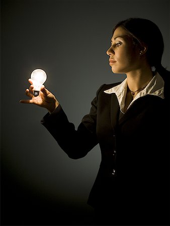 simsearch:640-01362739,k - Profile of businesswoman with light bulb Stock Photo - Premium Royalty-Free, Code: 640-01358829